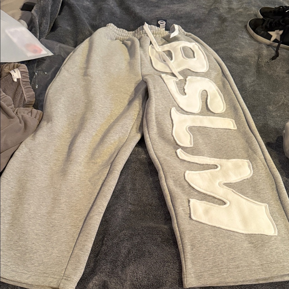Gray Sweatpants with White Lettering BSLM . NWT. Xs